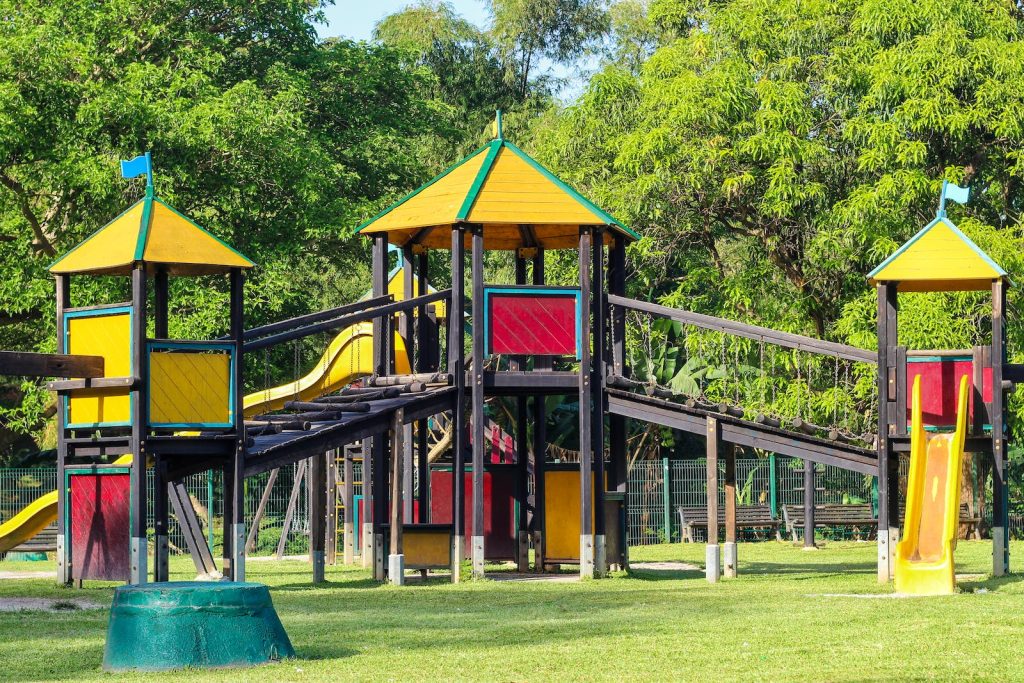 A colorful playground with slides and swings
